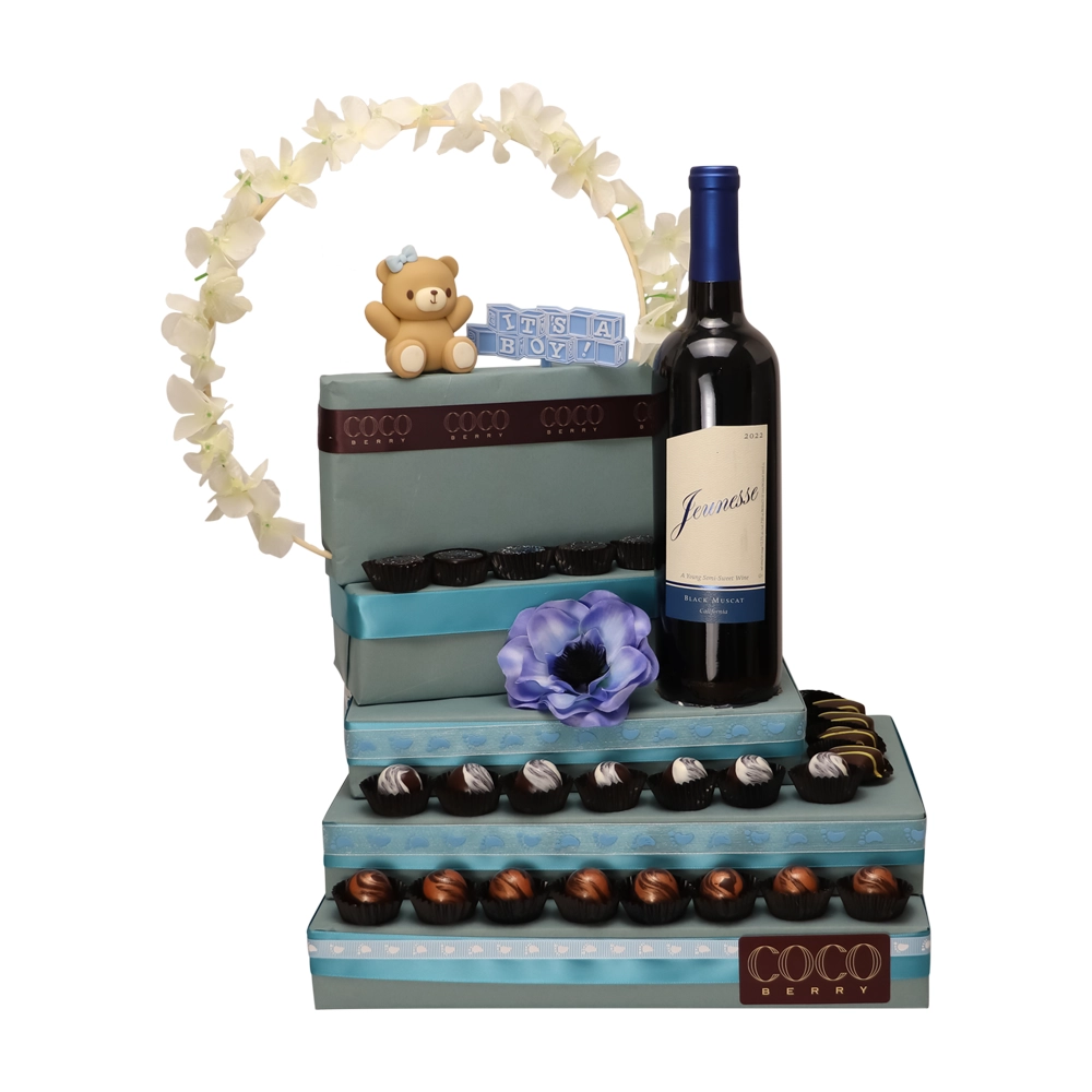 Blue arch arrangement with wine and teddy